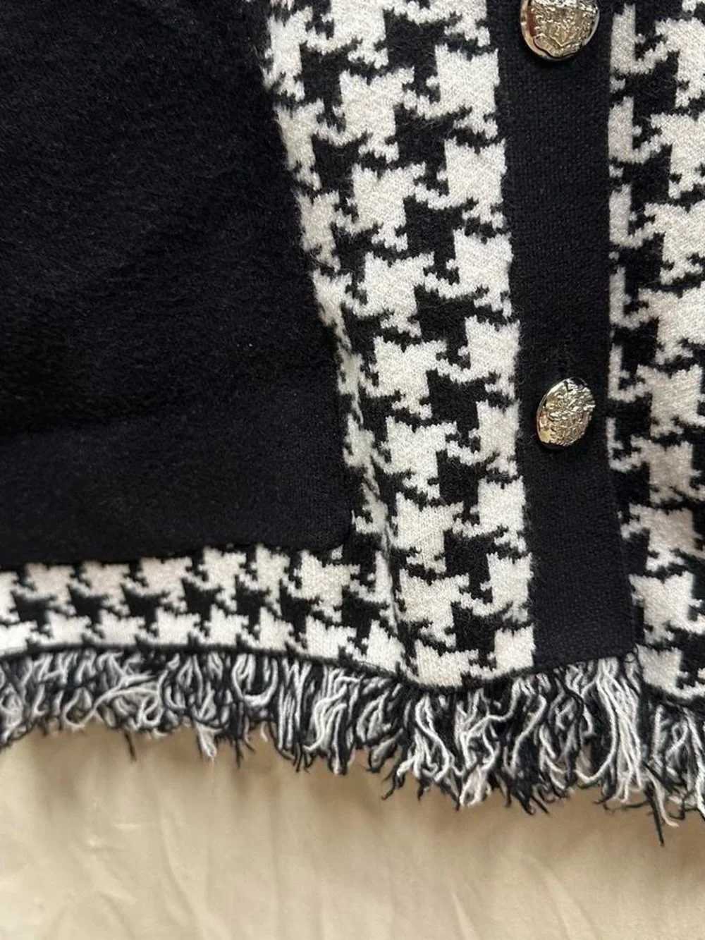 Preppy long sleeve checkered black and white sweater.